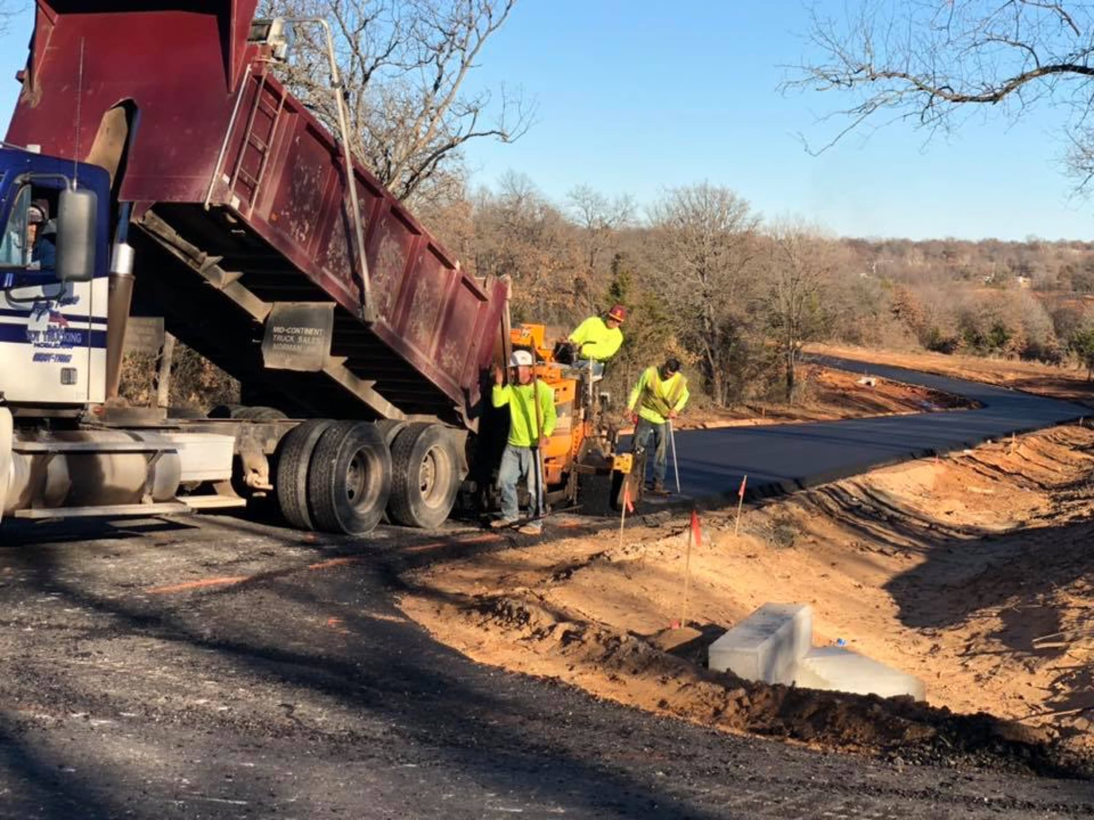 Asphalt paving dumptruck feed