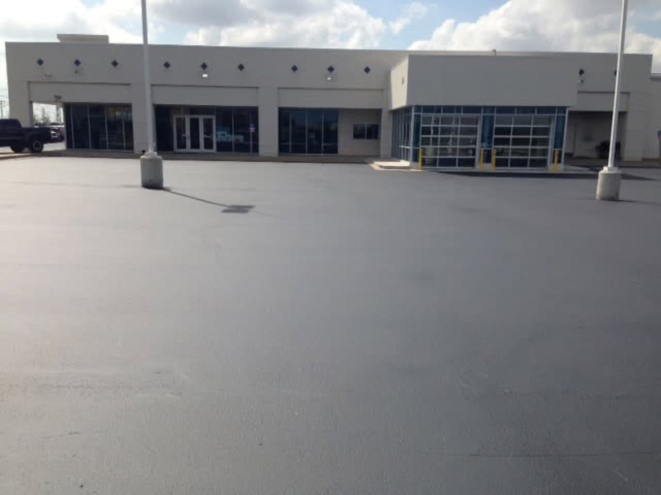 Sealcoating commercial lot dealership