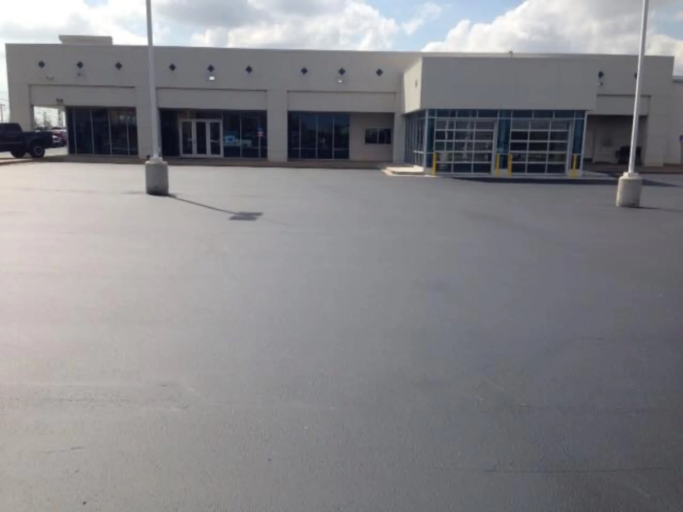 Sealcoating commercial lot dealership