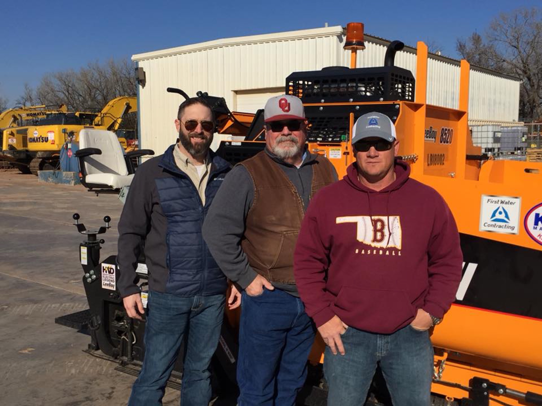 First Water's founders at the yard with a company paver