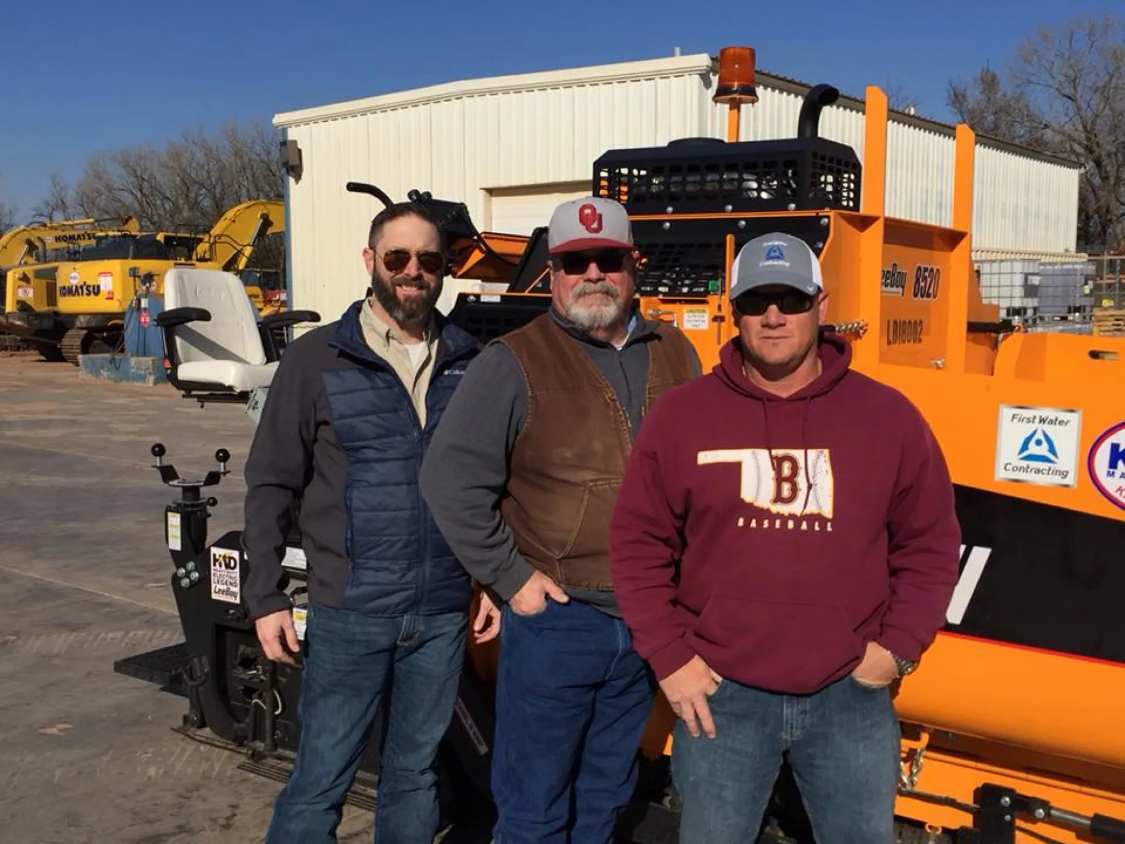 First Water's founders at the yard with a company paver